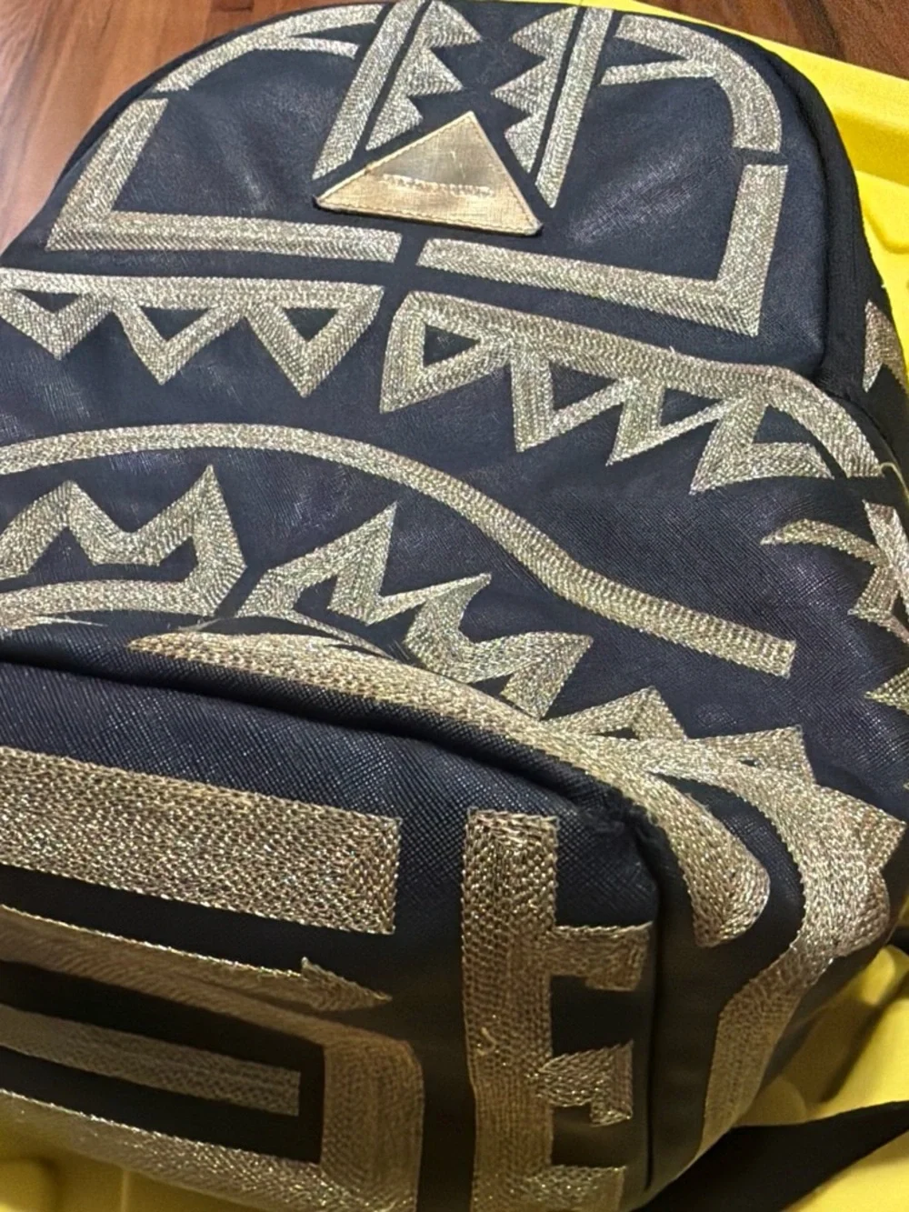 Sprayground Black Backpack with Metallic Gold Tribal Pattern